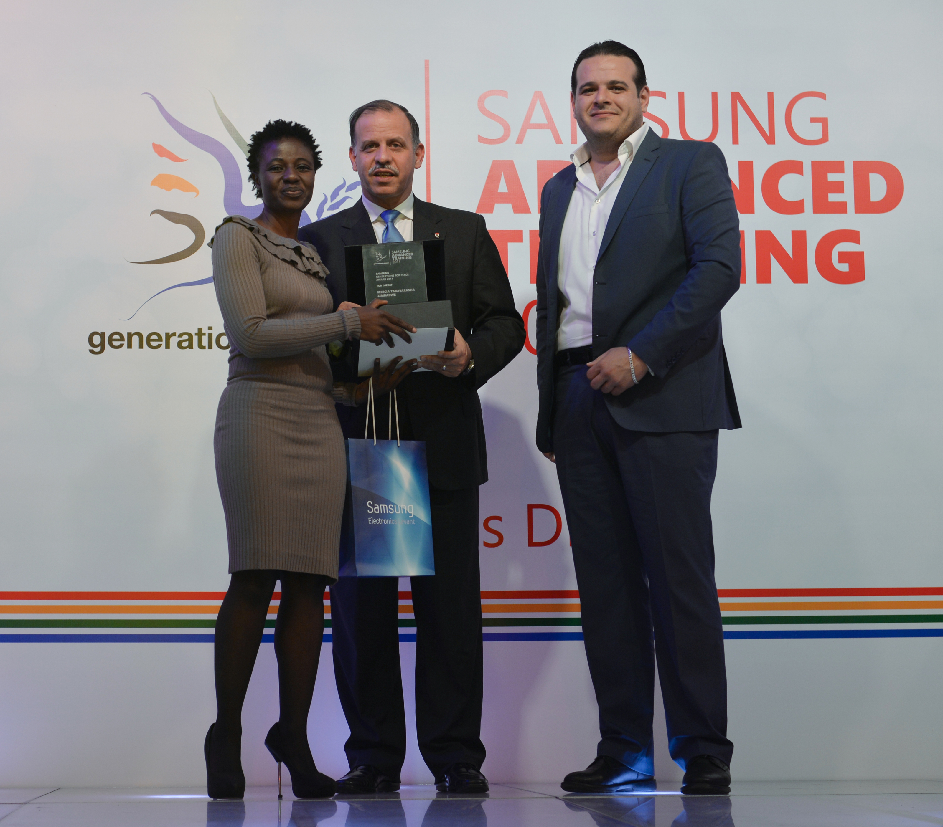 Mercia receiving her award from HRH Prince Feisal Al Hussein and Mr Fadi Awni Abu Shamat (Samsung Levant), and their fellow facilitators